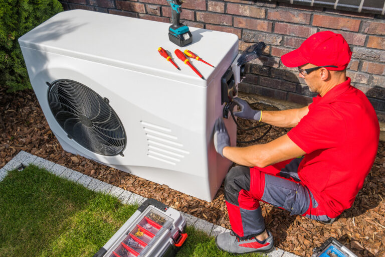 A Red Tshirt Man doing AC Service Job